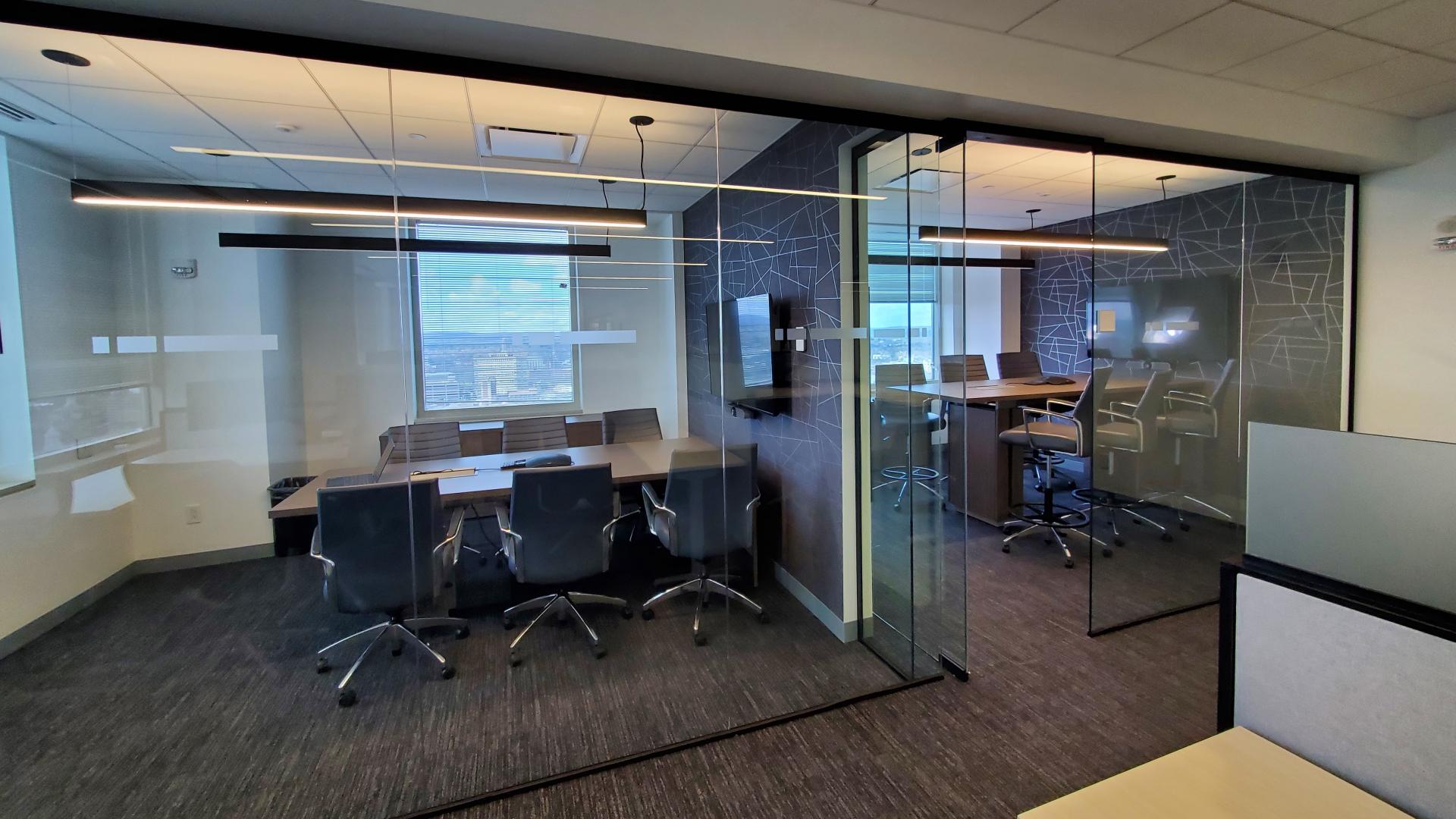 Meeting rooms outfitted with traditional tables and chairs as well as high to tables and bar stool height seating